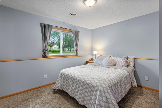 The 3rd and 4th bedroom are in the lower level. | Image 19
