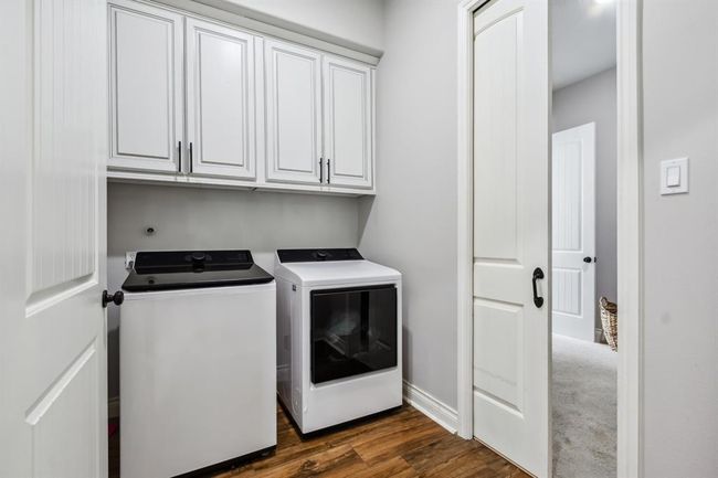 Experience ultimate convenience with direct access from the primary bedroom to the laundry room, via the primary closet. A clever pocket door links the closet to the laundry area. | Image 22