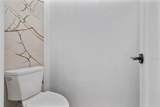 Bathroom featuring toilet | Image 9