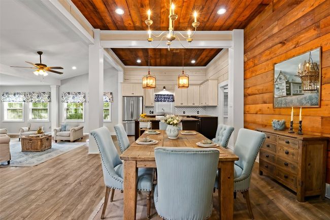 *Virtually Staged*Dining area with wood ceiling, wood finished floors, recessed lighting, and a healthy amount of sunlight | Image 12