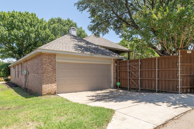 Garage with concrete driveway | Image 35