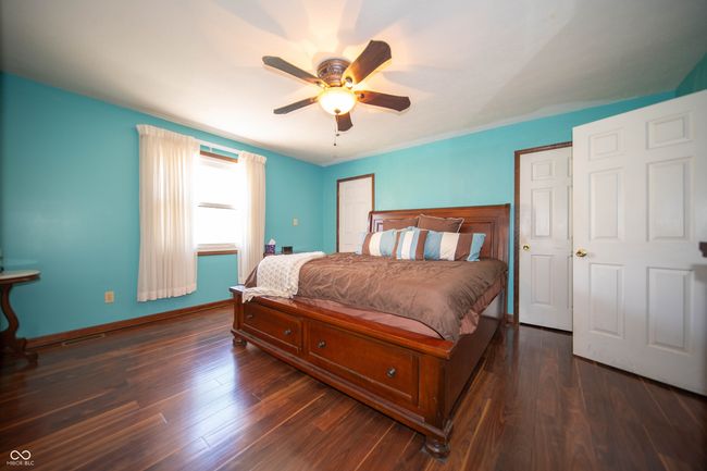 Master Bedroom with wood floors, and Walk-in Closets. | Image 16