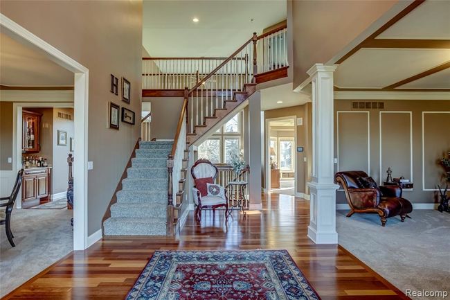 Brazilian Cherry hardwood floors, dual access staircase leading to the upper level off your open foyer | Image 6