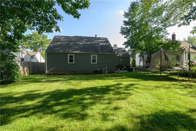 Rear view of property with a trampoline | Image 6