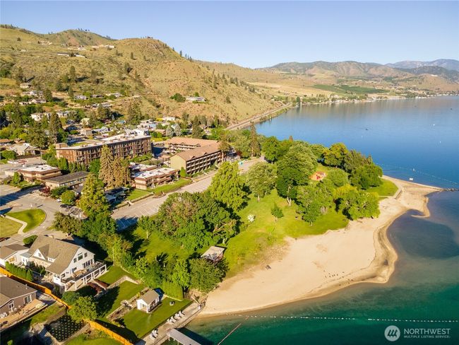 Conveniently located next to Lakeside Park for public lake access plus a children's playground, basketball, volleyball, sandy beaches, day-use docks. Karma Vineyards, Bear Mountain Golf Course and Chelan Municipal Course are just a short drive away | Image 31