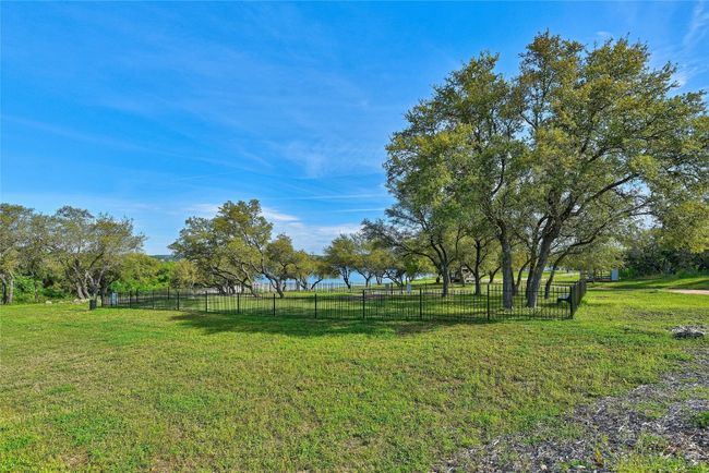 Let your dogs run leash free in the fully fenced dog park or enjoy walking your dog on the 14 acre park along the lake shore. | Image 32