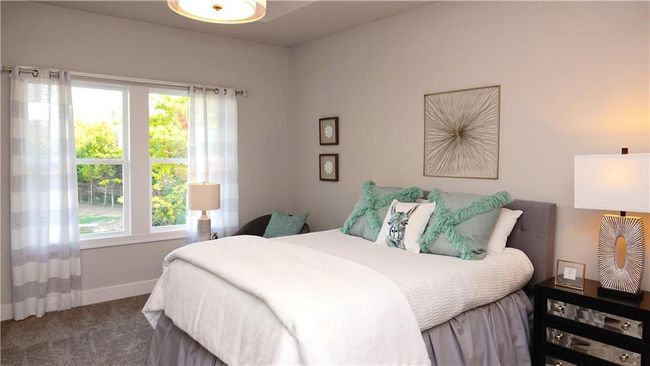 Carpeted bedroom with baseboards | Image 34