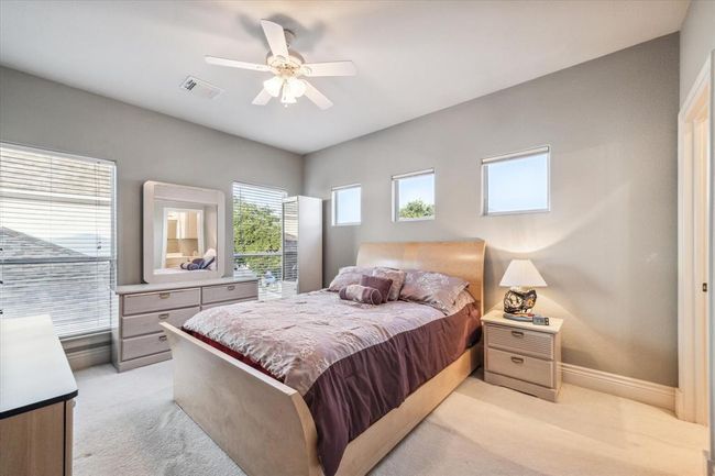 Bedroom #3 located upstairs features carpet and an en suite bathroom. | Image 28