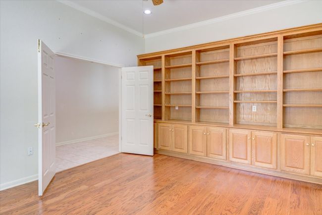 Empty room with ornamental molding and light wood finished floors | Image 6