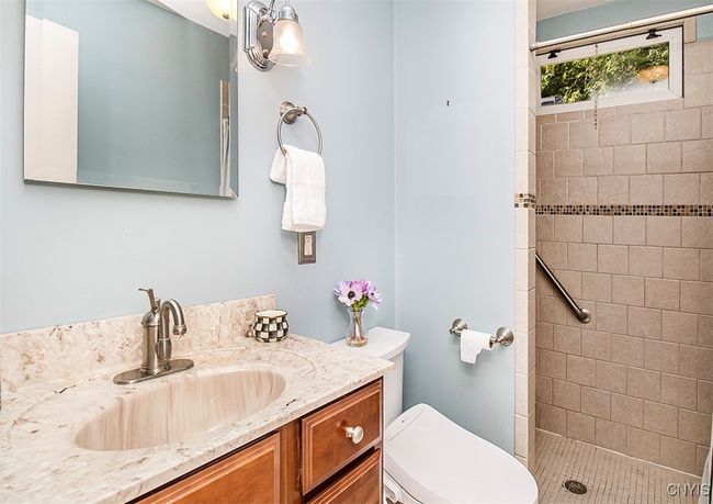 Main floor full bath with small step into shower... | Image 27