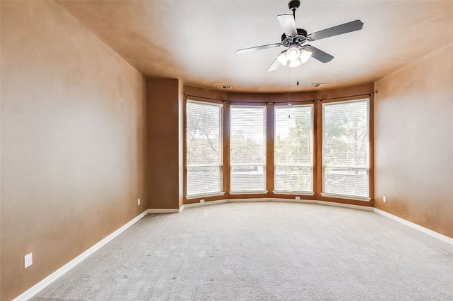 Spare room with carpet, baseboards, ceiling fan, and visible vents | Image 22