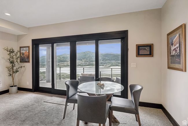 Dining area featuring carpet floors, a mountain view, healthy amount of natural light, and recessed lighting | Image 46