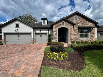 Amazing home with paved driveway, three car garage and spacious front porch | Image 1