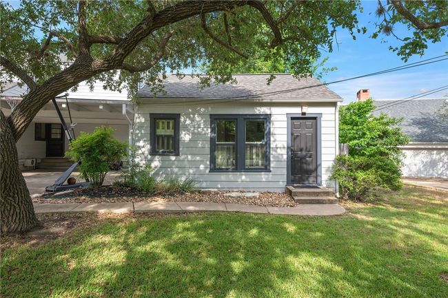 View of front of home featuring a front lawn, roof with shingles, and entry steps | Image 36