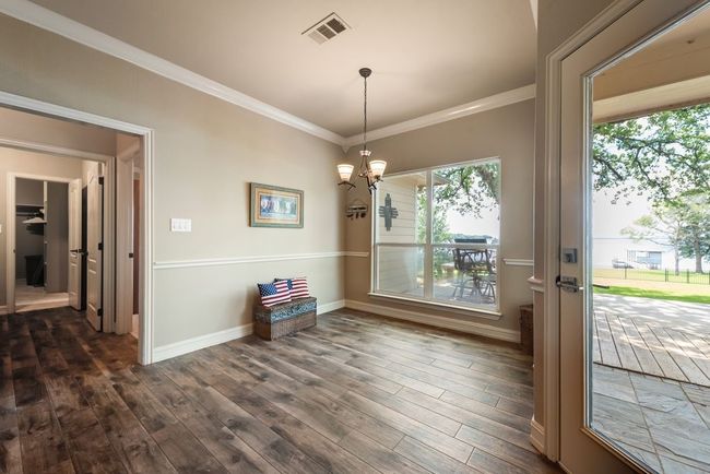 This dining room area offers up meals with a view and quick access to the back deck! | Image 15
