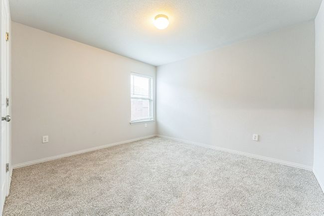 Carpeted spare room with baseboards | Image 10