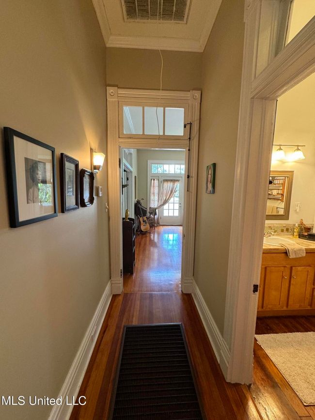 In hall facing den | Image 9
