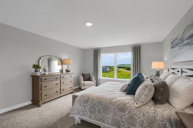 The large primary suite is an oasis and offers a private bath and two walk in closets. Model photos. Options and colors will vary. | Image 20
