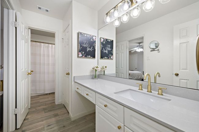Full upstairs bath includes 2 separate vanity areas for added utility | Image 31