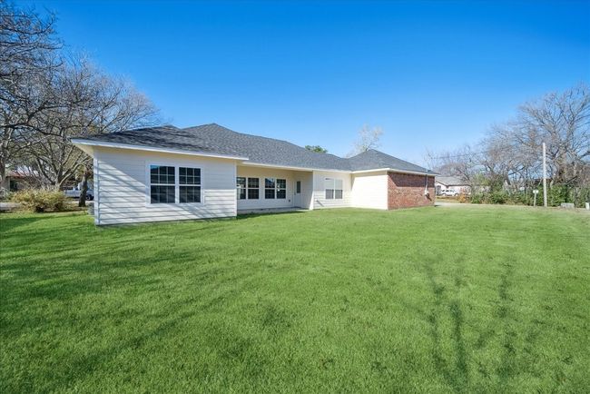 Back of house with a lawn | Image 18
