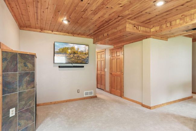 Newer carpet in the lower level. | Image 35
