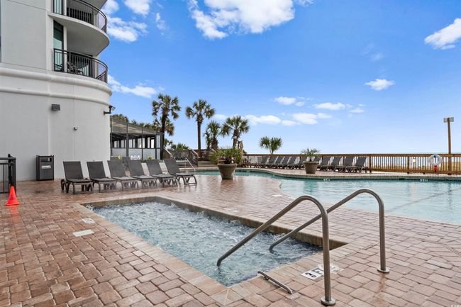 Community pool with a patio area | Image 30