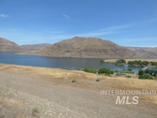 Water view with a mountainous background | Image 25