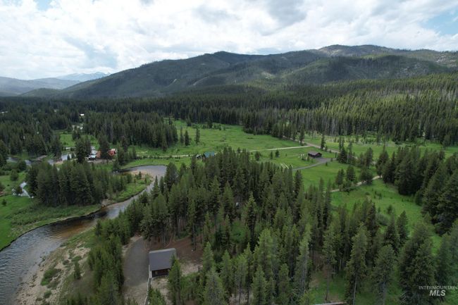 View of mountain backdrop with a heavily wooded area | Image 27
