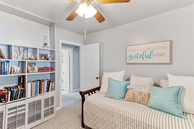 Bedroom #3 (11x10) features built-in shelving for books and decor, offering both functionality & charm in this comfortable space. | Image 17