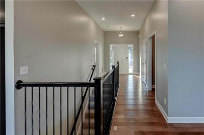 Hall with hardwood / wood-style flooring | Image 2