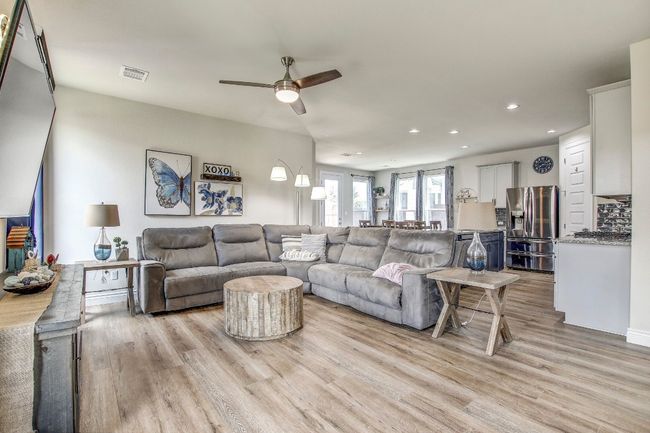 Living room featuring light wood-type flooring, recessed lighting, and a ceiling fan | Image 8