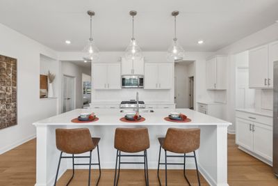 (*Photo of decorated model, actual homes colors and finishes will vary) Imagine preparing a wonderful meal for dinner in this kitchen or entertaining friends and family over the weekend! | Image 3