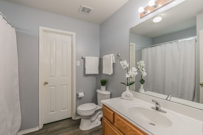 Full bath featuring wood finished floors and vanity | Image 31