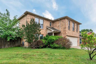 View of front of house with a garage and a front lawn | Image 2