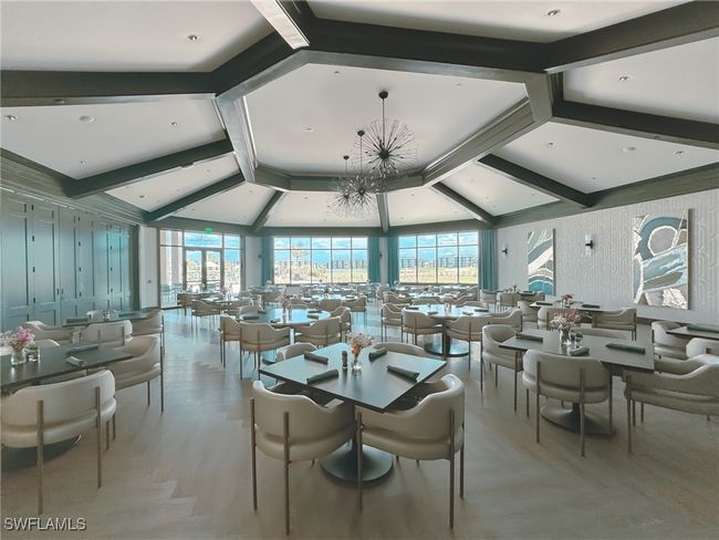 Dining room featuring a wall of windows | Image 49