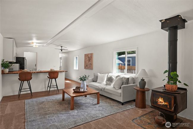 Cozy up by the wood stove and settle into a move-in ready home that blends value, charm, and convenience! | Image 4
