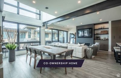 Dining area featuring ceiling fan and wood-type flooring | Image 1