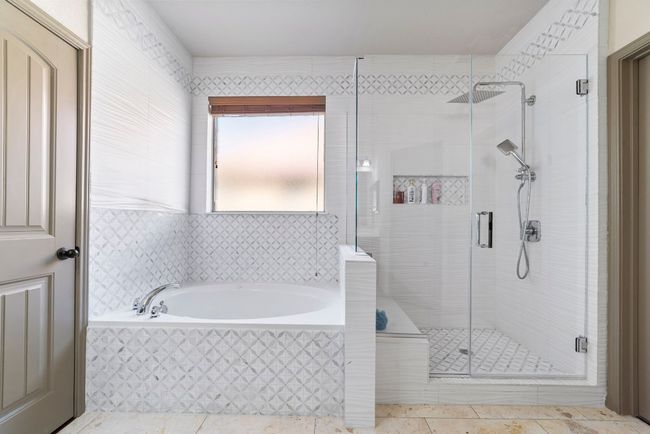 Bathroom featuring a bath, a shower stall, and tile patterned flooring | Image 23