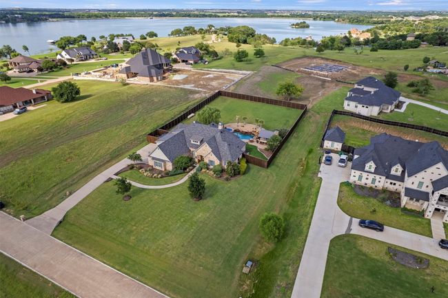 Aerial view of property and surrounding area featuring a nearby body of water and nearby suburban area | Image 36