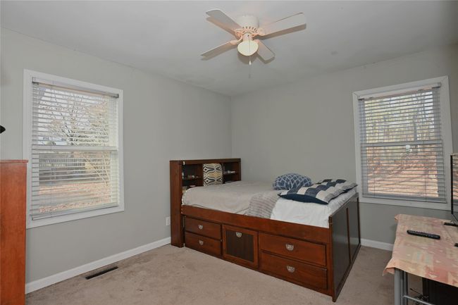 Carpeted bedroom with ceiling fan | Image 20