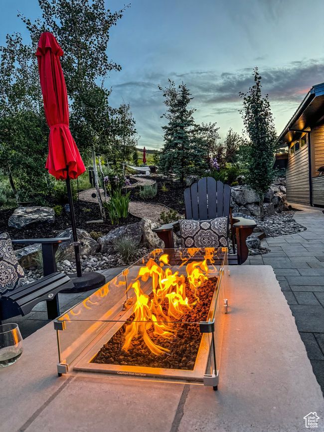 View of patio featuring a fire pit | Image 76
