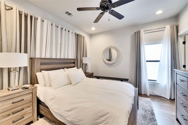 Bedroom featuring wood finished floors, recessed lighting, and ceiling fan | Image 17