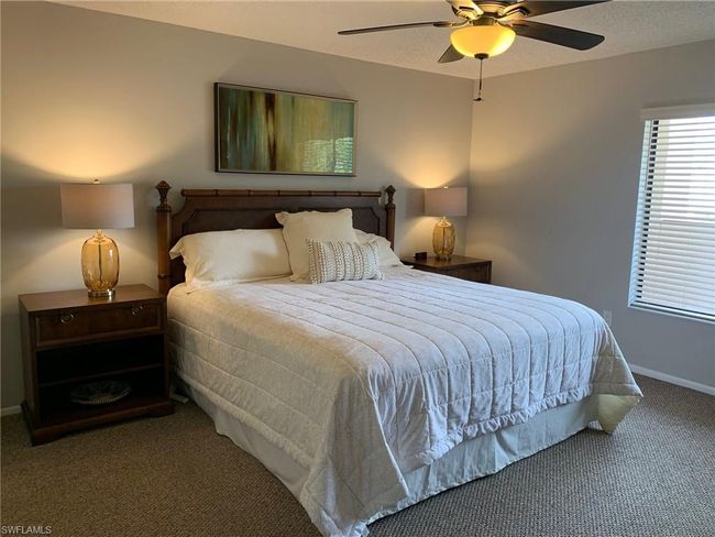 Bedroom featuring carpet floors and ceiling fan | Image 11