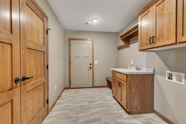 Laundry room and storage closet | Image 17