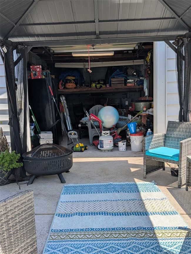 View of interior of garage and part of driveway | Image 5