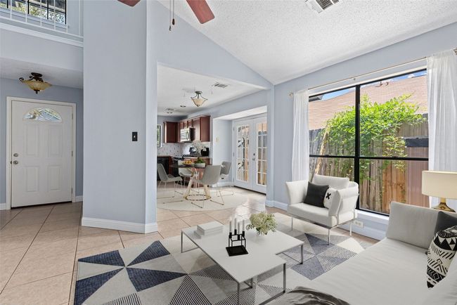 *virtually staged* The dining area sits just off the kitchen, open and easy, but still defined enough to feel like its own moment in the layout. | Image 12
