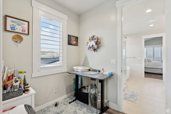 Interior space with recessed lighting, wood finished floors, and baseboards | Image 17