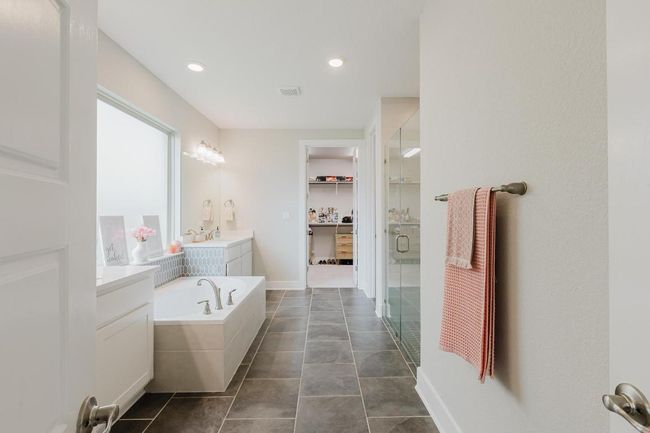 Primary bathroom extending to walk-in closet | Image 16