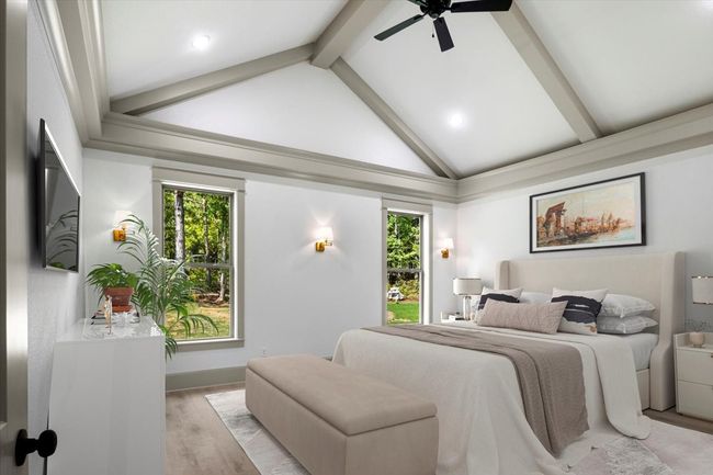 Bedroom featuring wood finished floors, beam ceiling, multiple windows, ceiling fan, and recessed lighting | Image 30