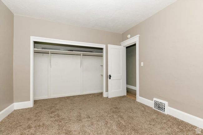 Empty room featuring a textured ceiling and baseboards | Image 20